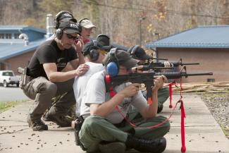 Instructor gives tips to shooter during a recent training at SCC's firing range.