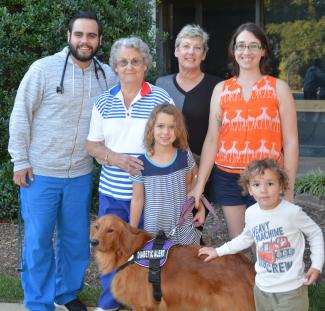 Nancy Kluttz and family pictured with scholarship recipient Evan Cann outside Harris Regional Hospital.