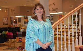 Woman poses for photo indoors